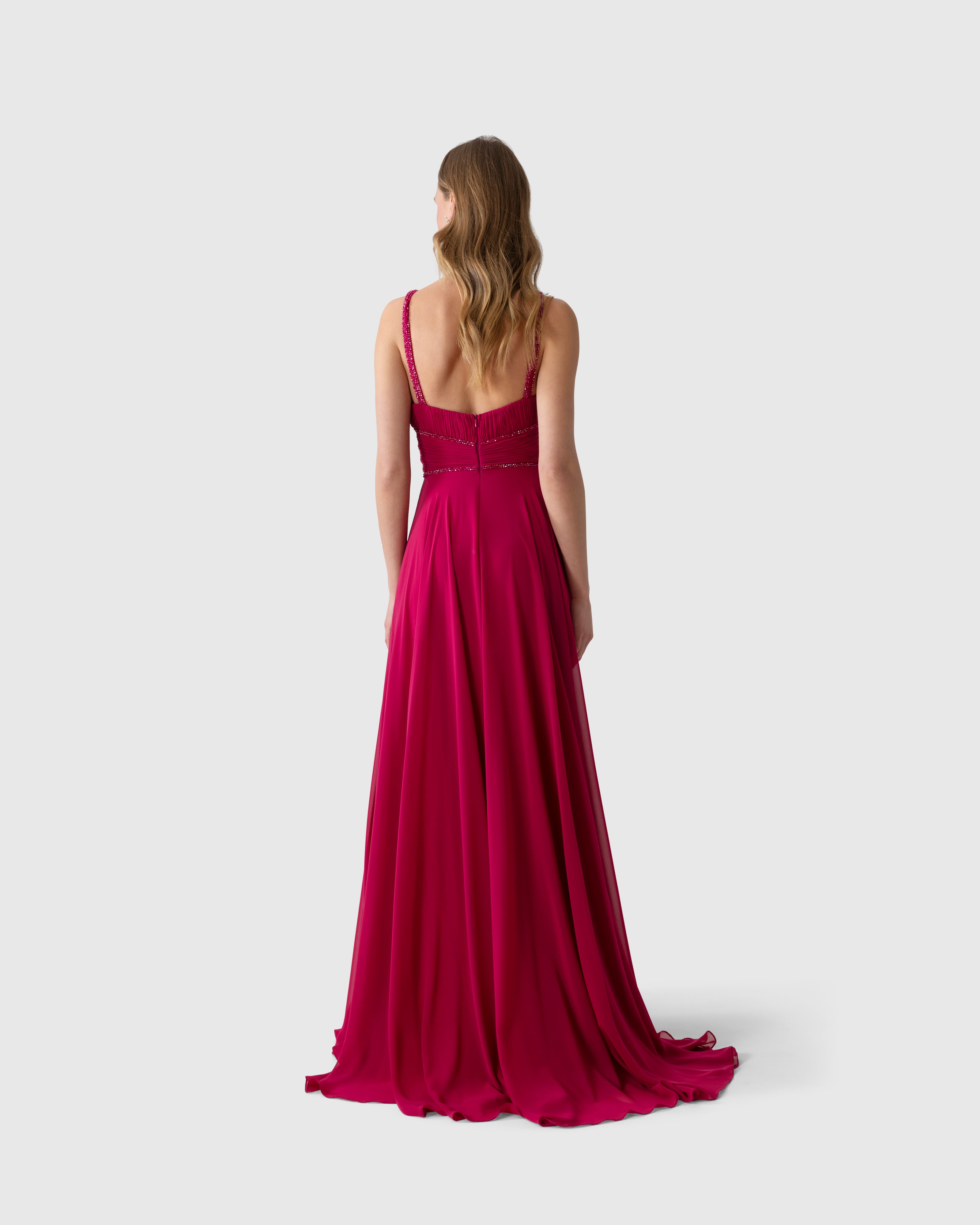 Abito lungo aderente magenta in georgette con ricamo