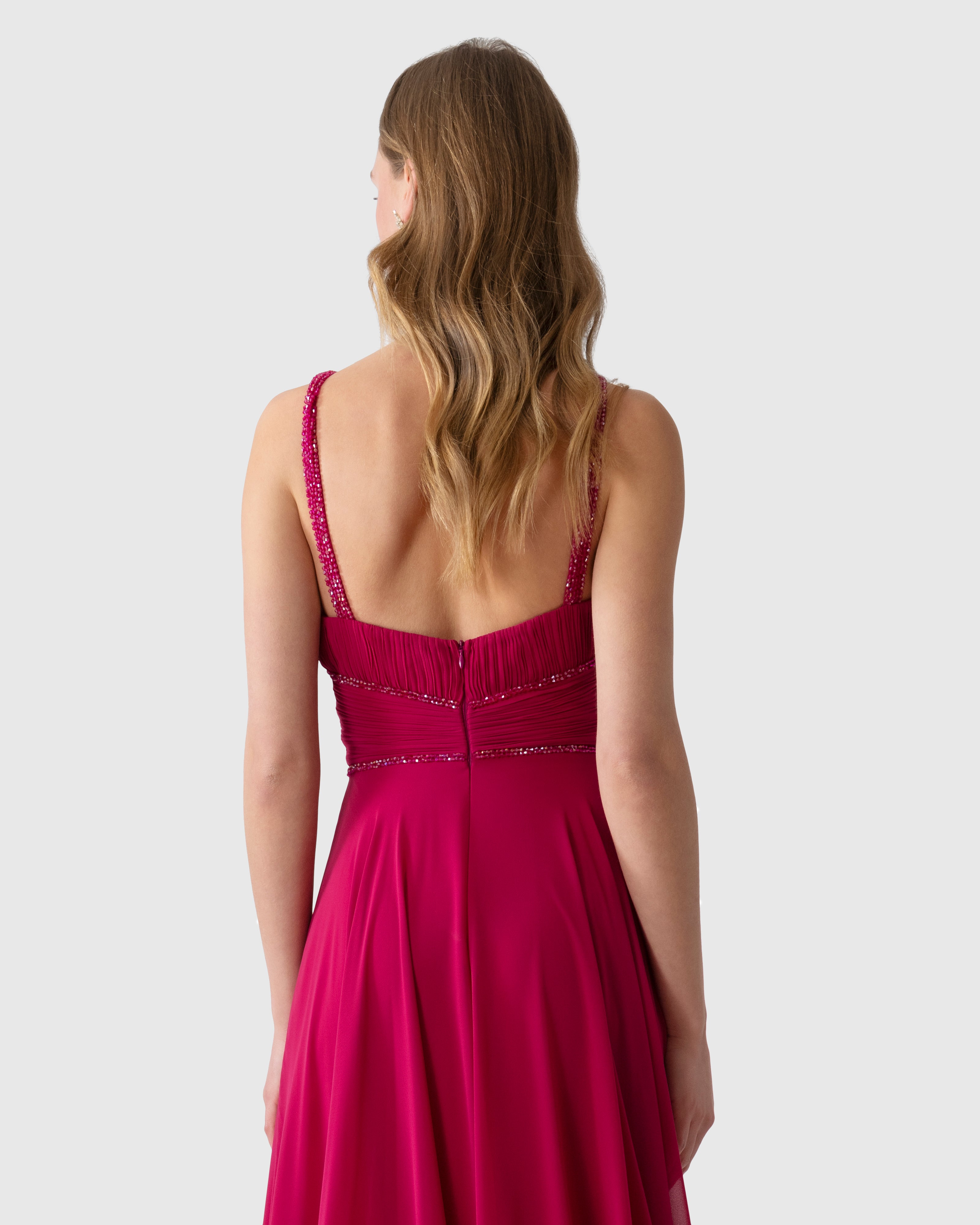 Abito lungo aderente magenta in georgette con ricamo